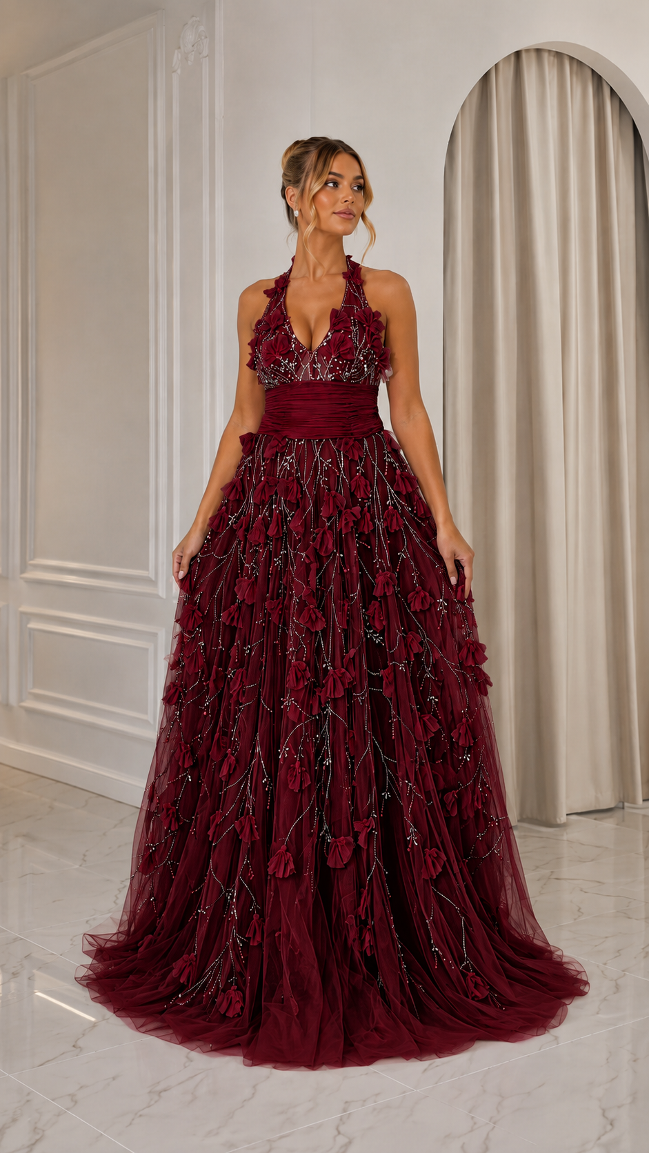 Front view of burgundy halter evening gown with dimensional floral detailing