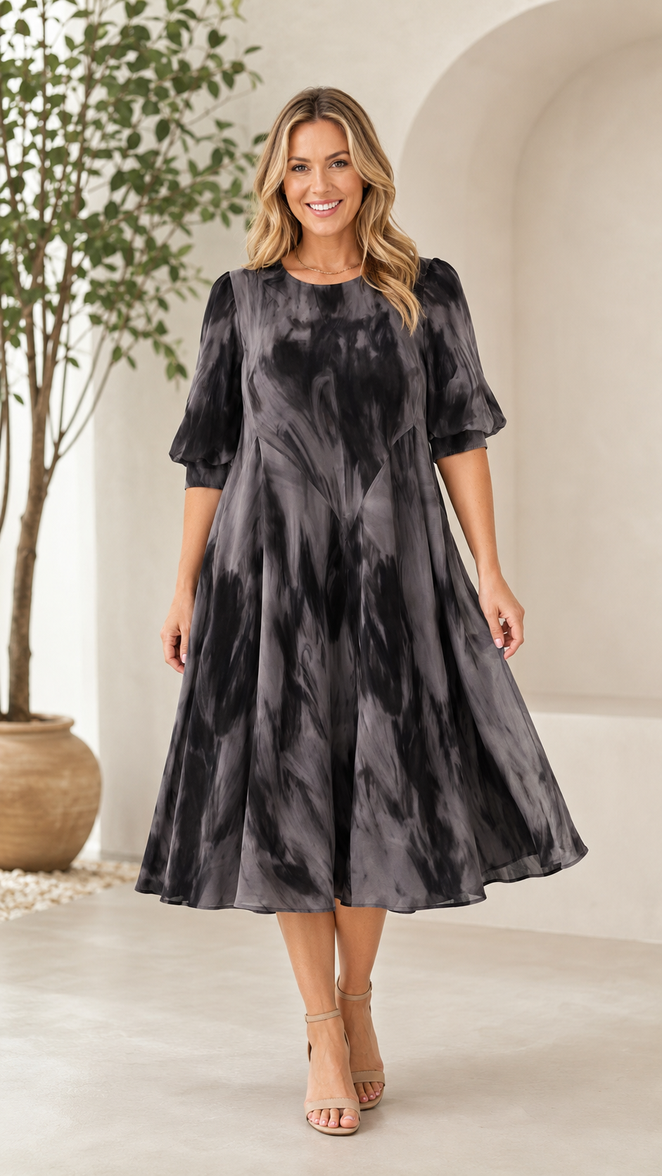 Front view of charcoal tie-dye midi A-line dress with puff sleeves
