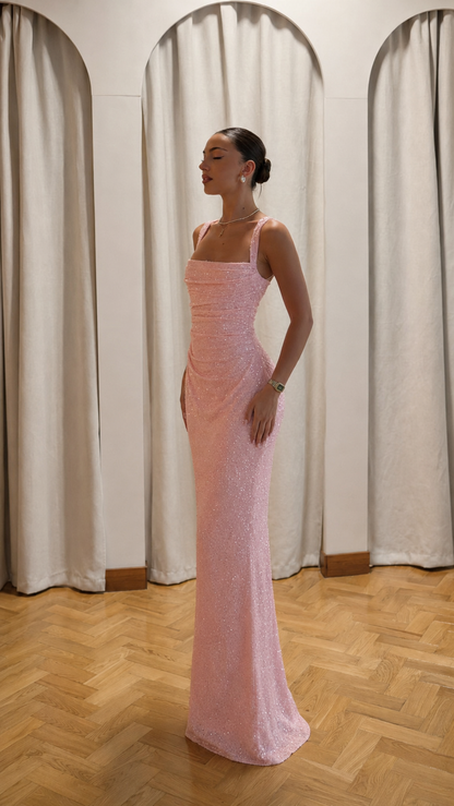 Side view of blush pink glitter evening maxi dress with fitted silhouette