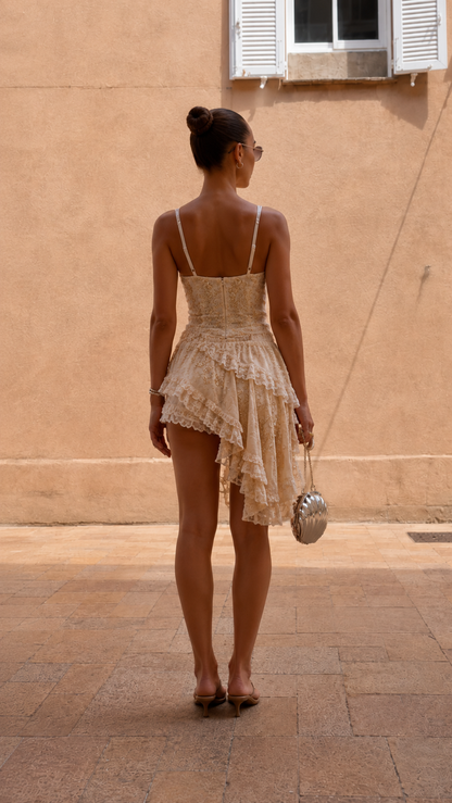 Back view of cream lace-look cami top and asymmetrical ruffle shorts set
