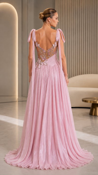 Blush pink evening gown back view with open back and flowing floor-length skirt
