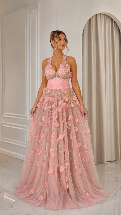 Front view of blush pink floral halter formal gown with ruched waistband