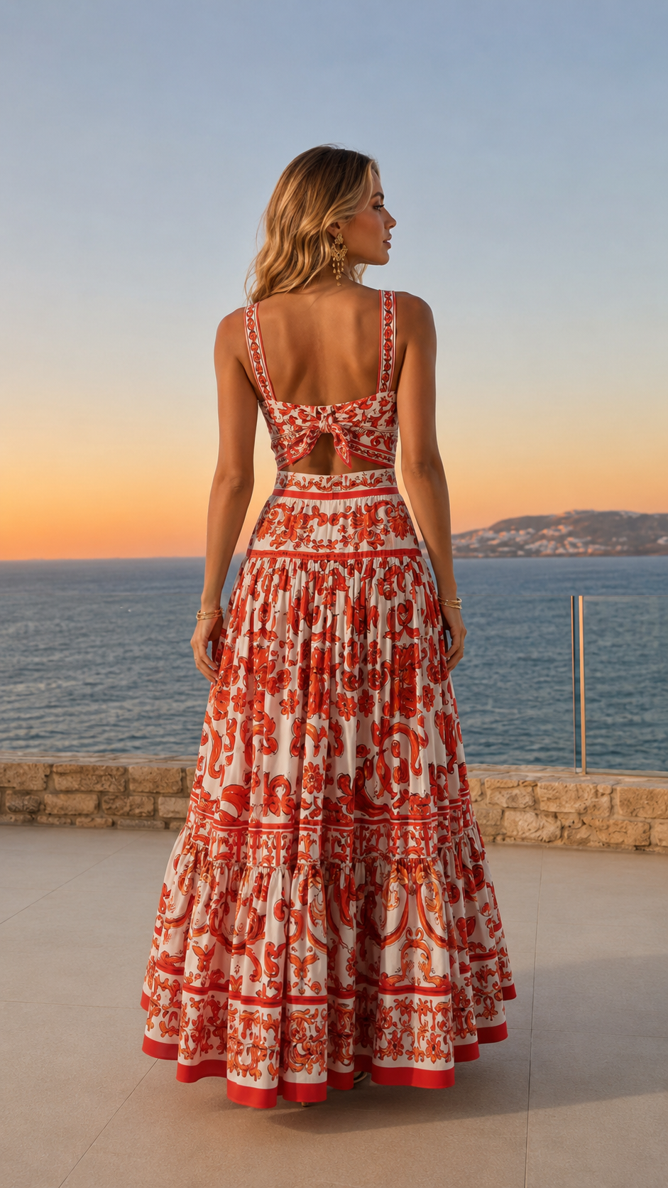 Back view of red and white printed maxi dress with open-back detail