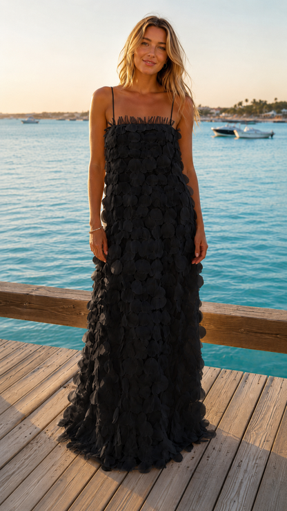 Black textured maxi dress with spaghetti straps and floral appliqué front view