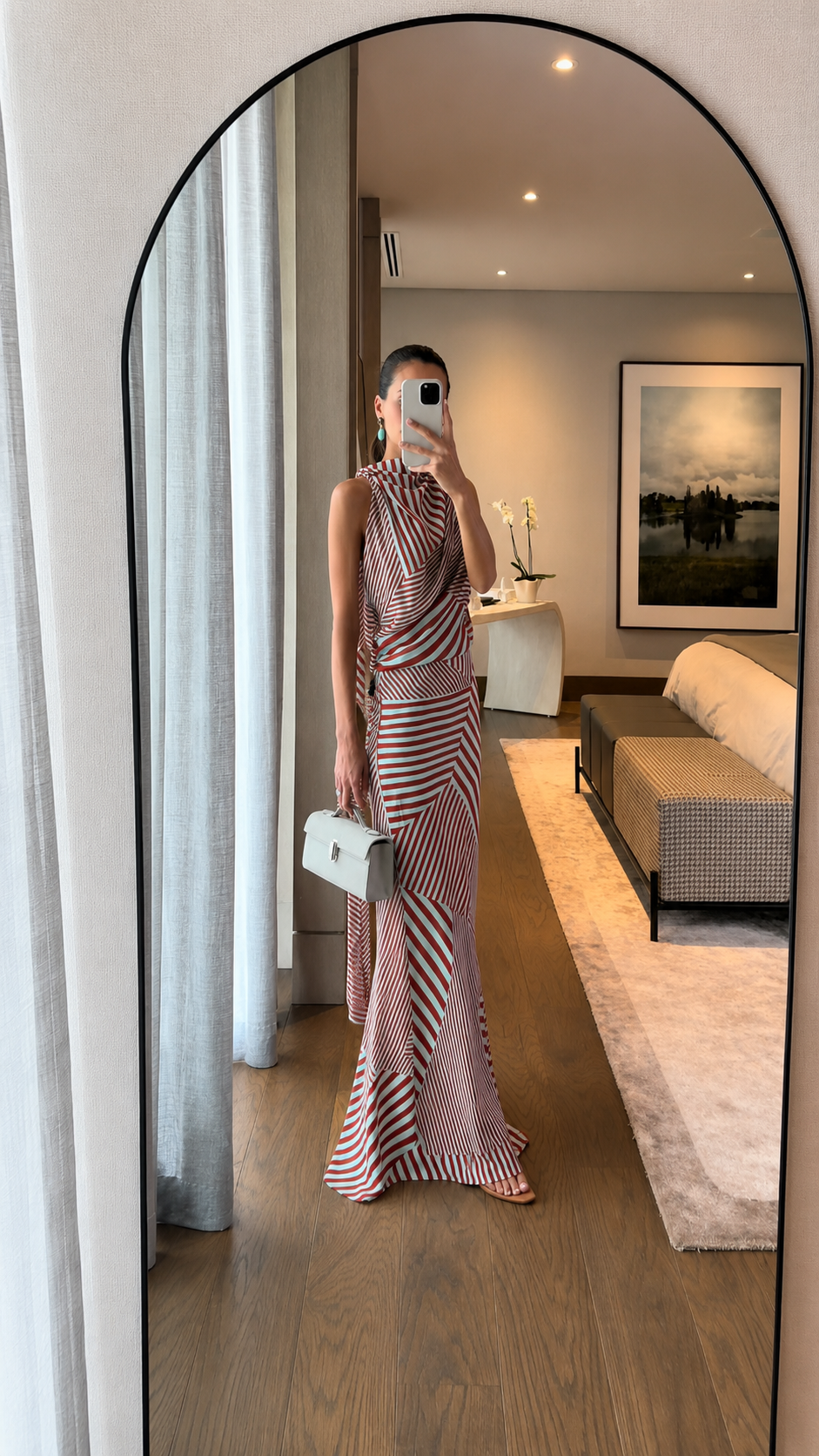 Full-body view of red striped slim-fit maxi dress with white handbag