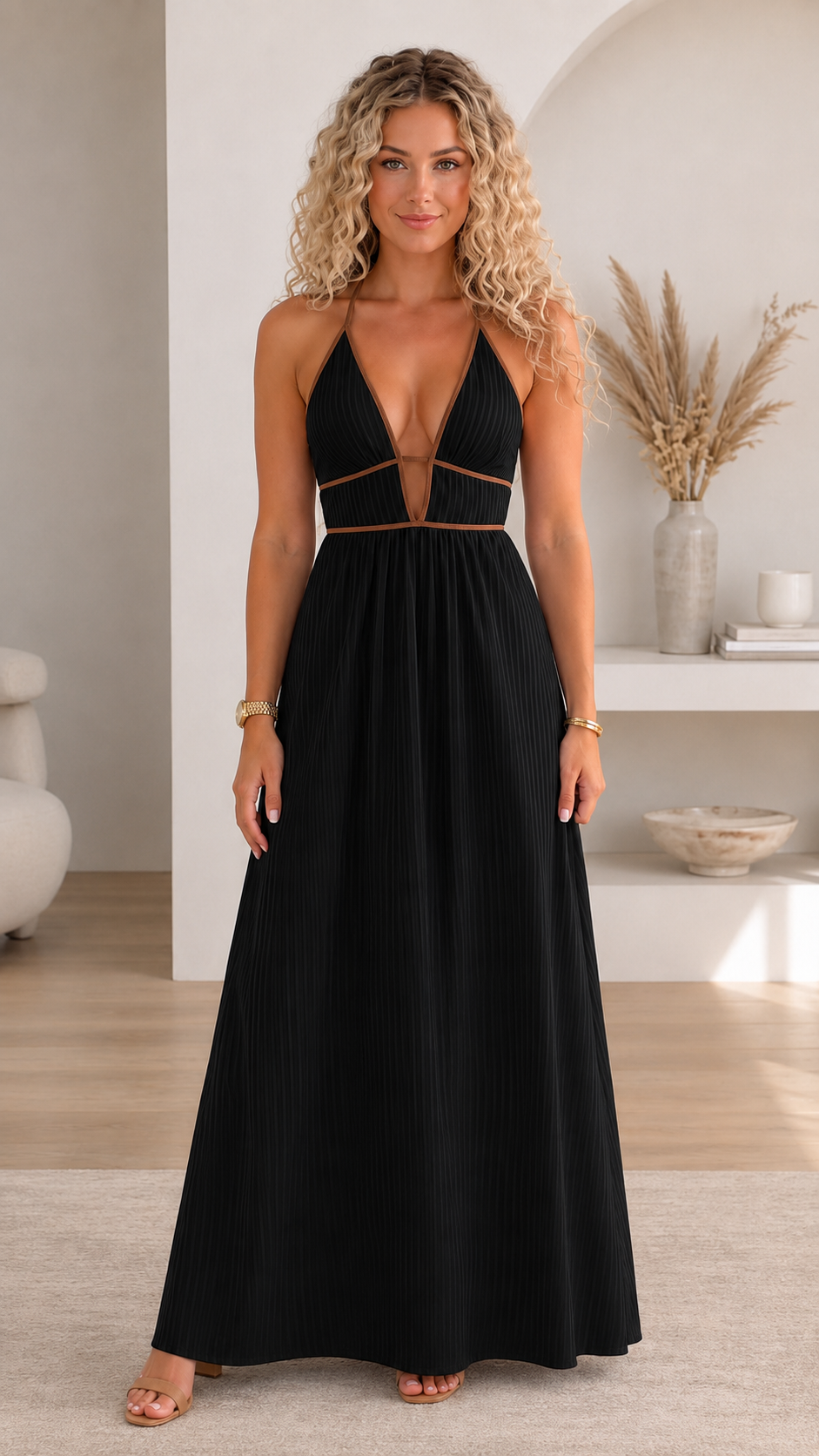 Front view of black pleated halter maxi dress with contrast trim and cutout waist