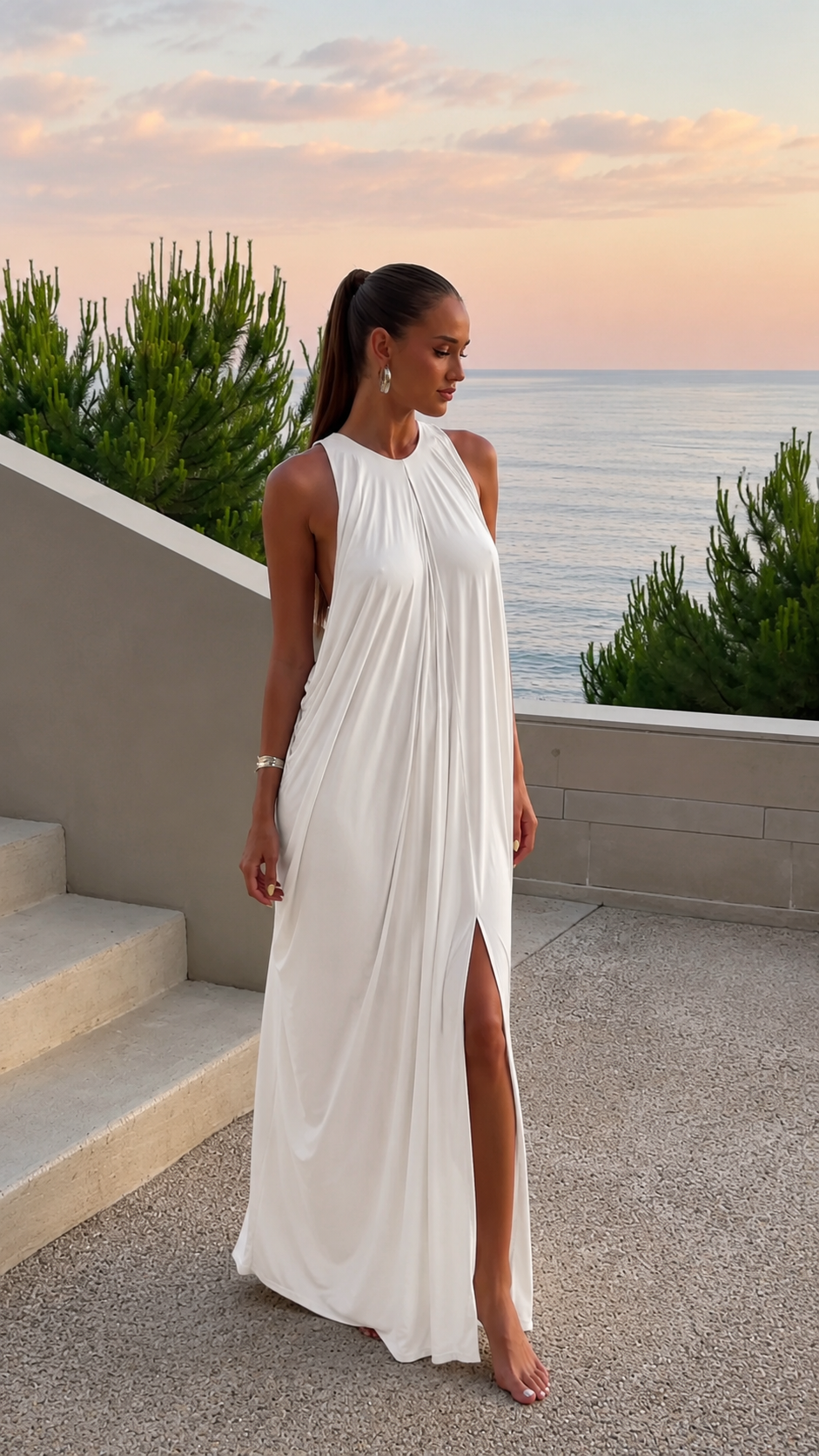White halter maxi dress with flowing silhouette and front slit