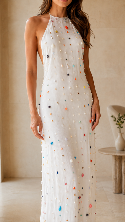 Close-up of white embellished halter neck slim maxi dress