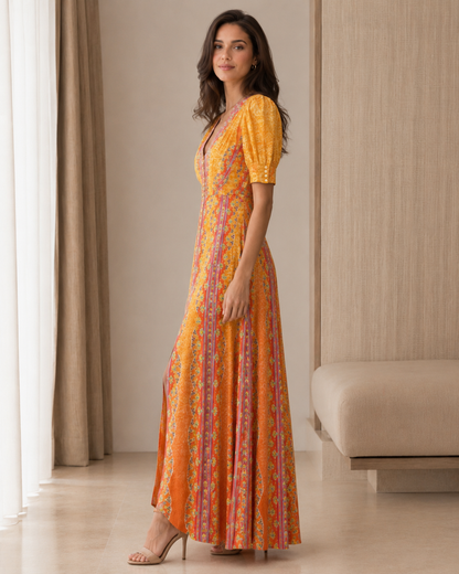 Side view of marigold printed puff sleeve maxi dress