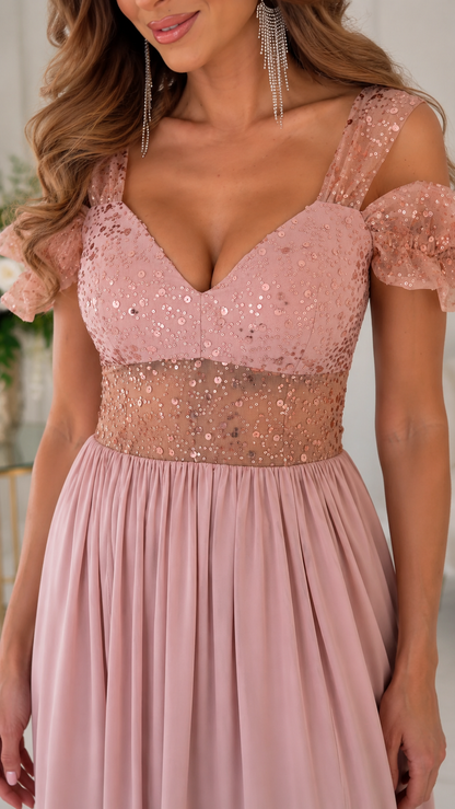 Close-up of blush pink evening dress with V-neck sequin bodice and sheer embellished waist