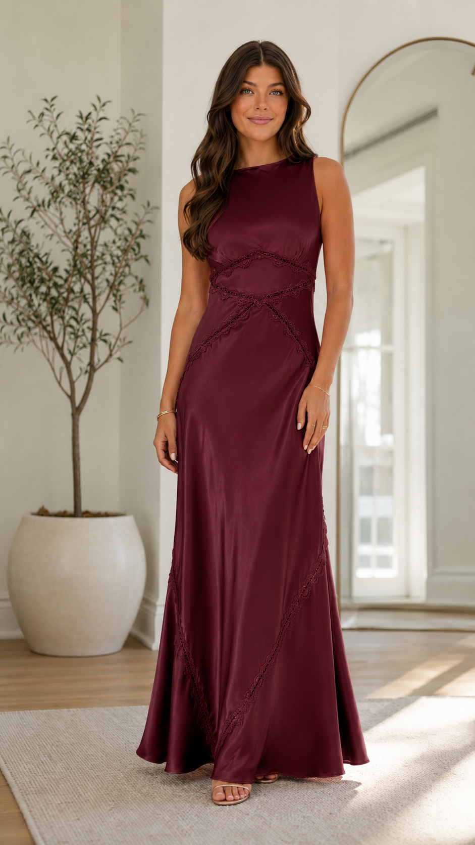 Front view of burgundy sleeveless satin-look maxi dress with seam detail