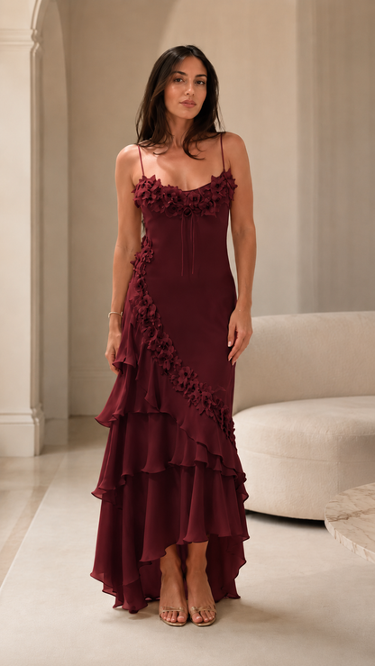 Front view of burgundy floral appliqué cami maxi dress with high-low skirt