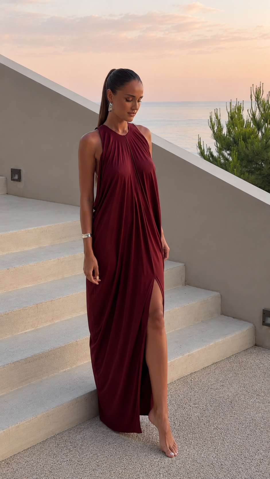 Burgundy halter maxi dress with fluid drape and high slit