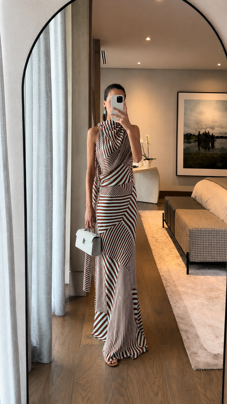 Full-length view of brown striped draped halter maxi dress