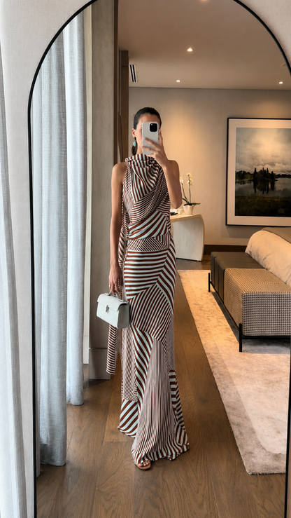 Full-length view of brown striped draped halter maxi dress