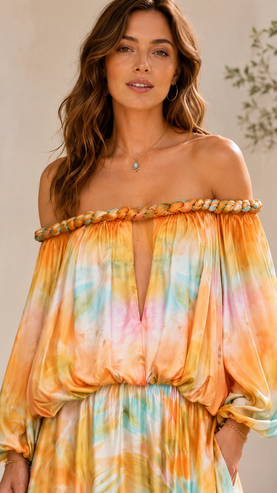 Close-up of sunset multi off shoulder neckline with braided trim and plunge front