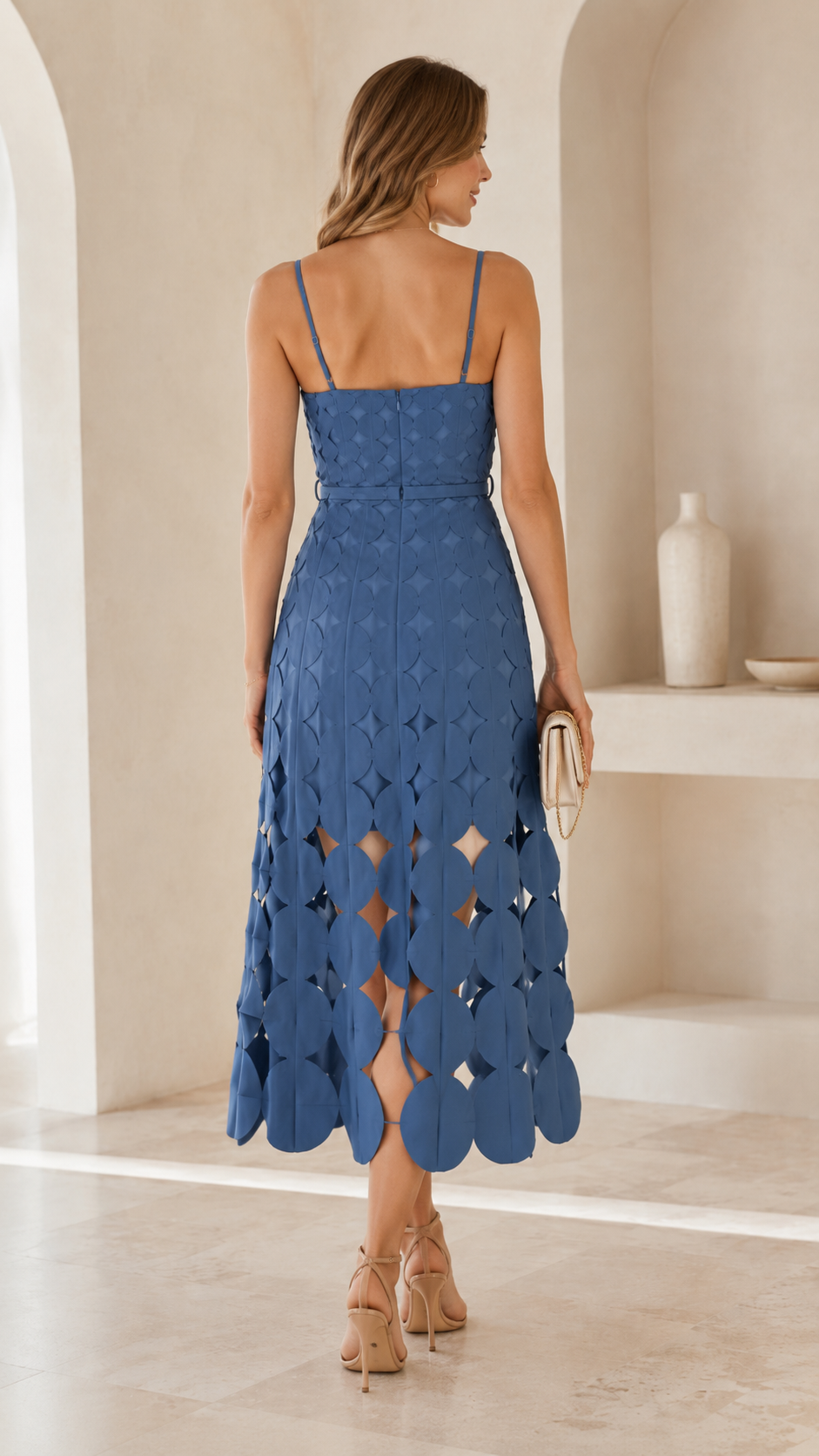 Back view of dusty blue midi dress showing slim straps and fitted bodice