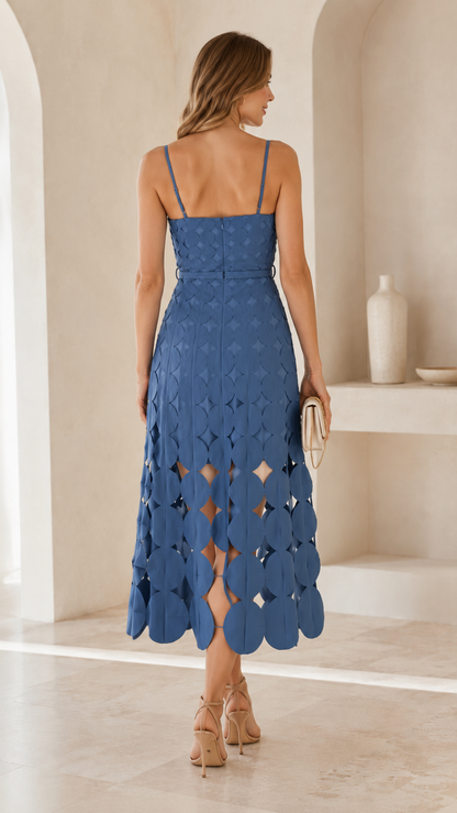 Back view of dusty blue midi dress showing slim straps and fitted bodice