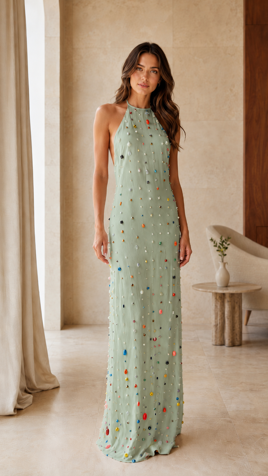 Model wearing a sage embellished halter neck maxi dress