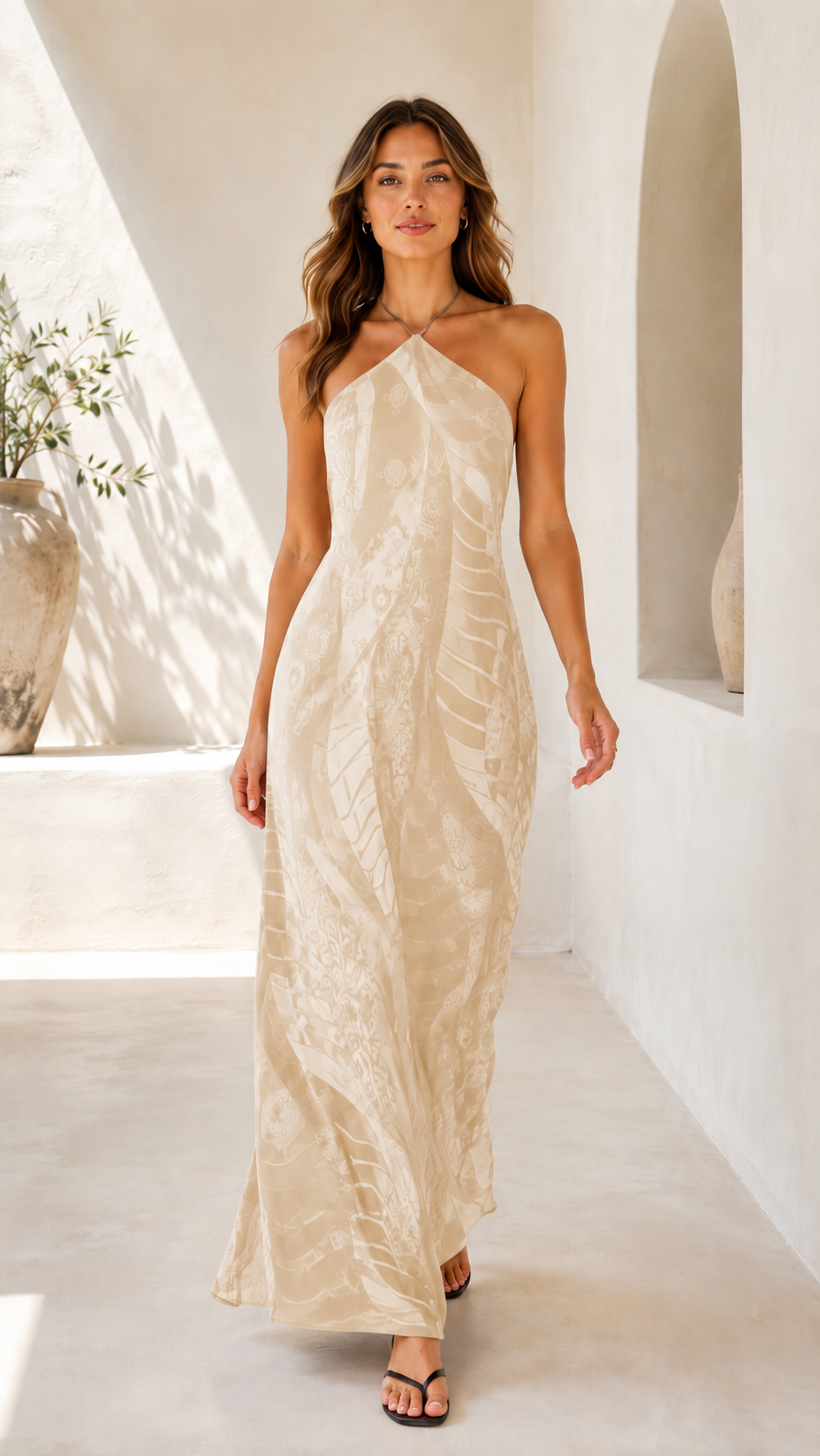 Front view of ivory halter neck maxi dress with tonal textured finish