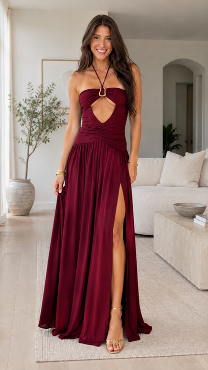 Front view of burgundy halter maxi dress with ring detail and high slit