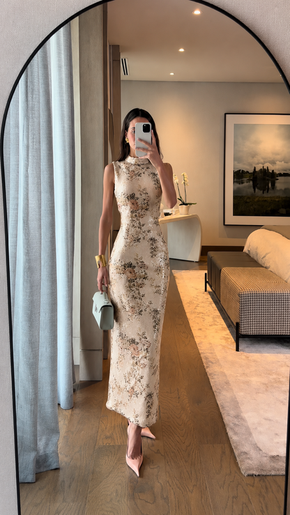 Front view of ivory floral sleeveless fitted long dress