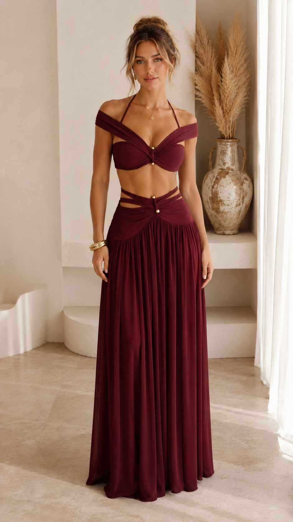 Front view of burgundy off-shoulder cutout waist maxi skirt set